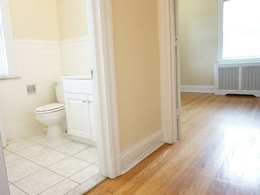 Hallway with a door leading into the bathroom in an apartment at Edgehill Court in Bala Cynwyd, PA.