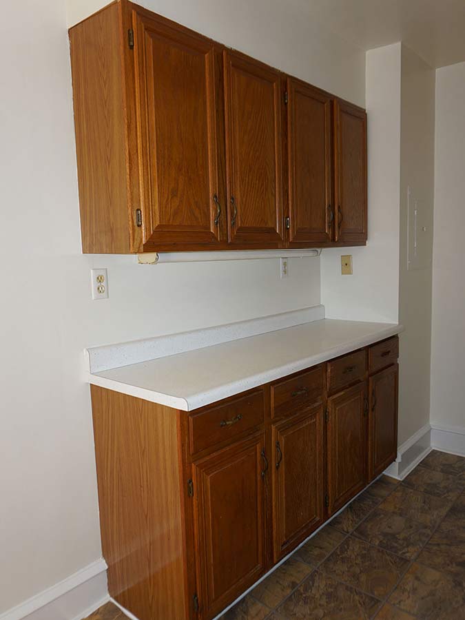 Wooden cabinet and countertop space in an apartment at Hazel Apartments in Upper Darby, PA.