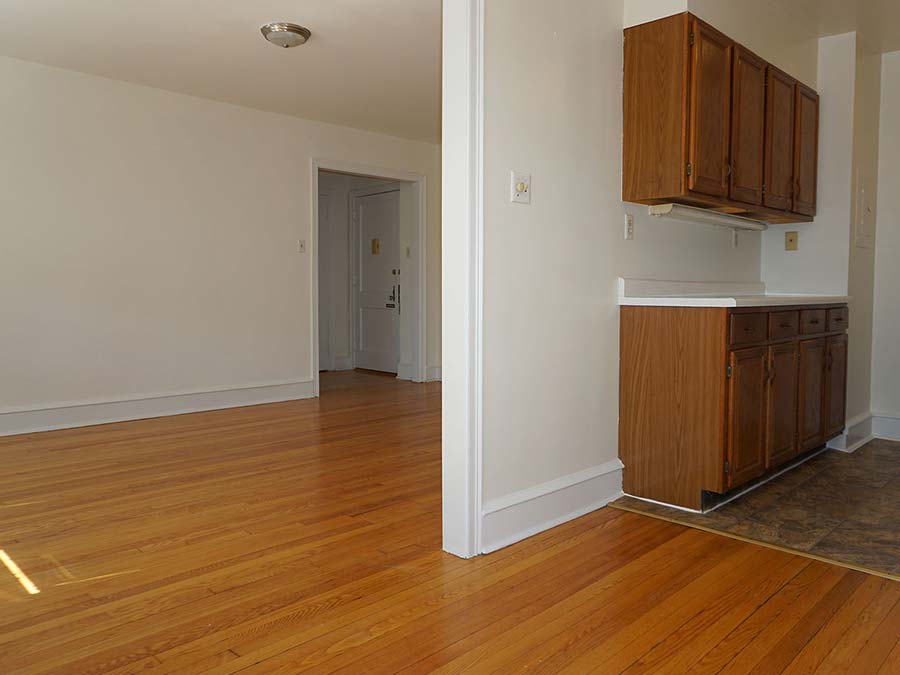 Spacious living room and dining room space in an apartment at Hazel Apartments in Upper Darby, PA.