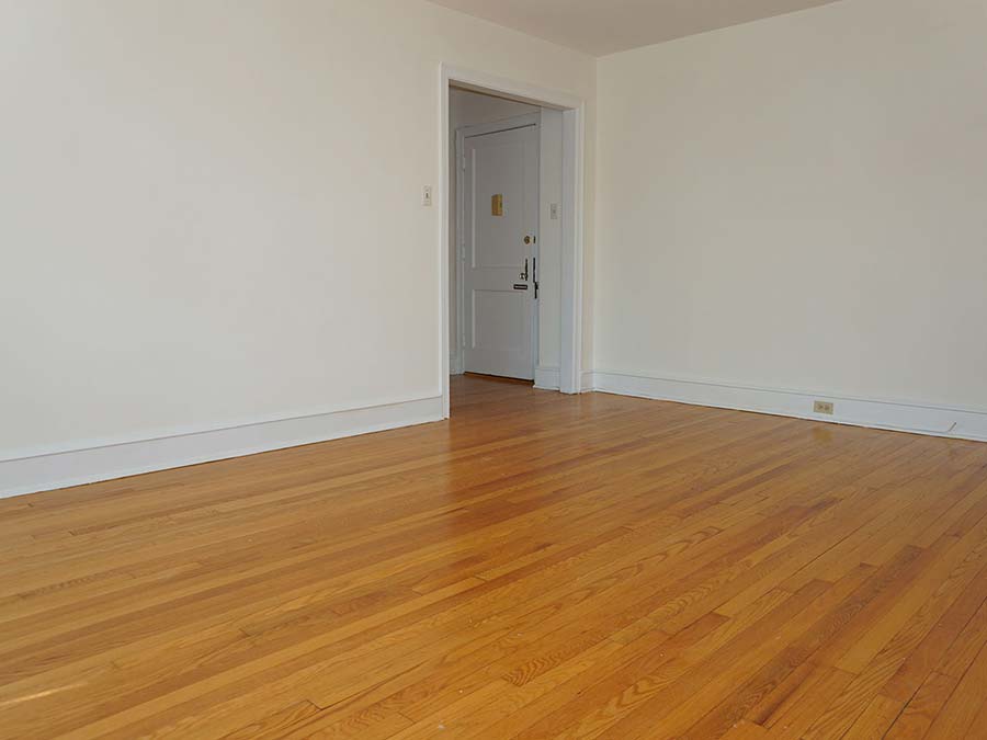 Spacious and unfurnished living room space at Hazel Apartments in Upper Darby, PA.