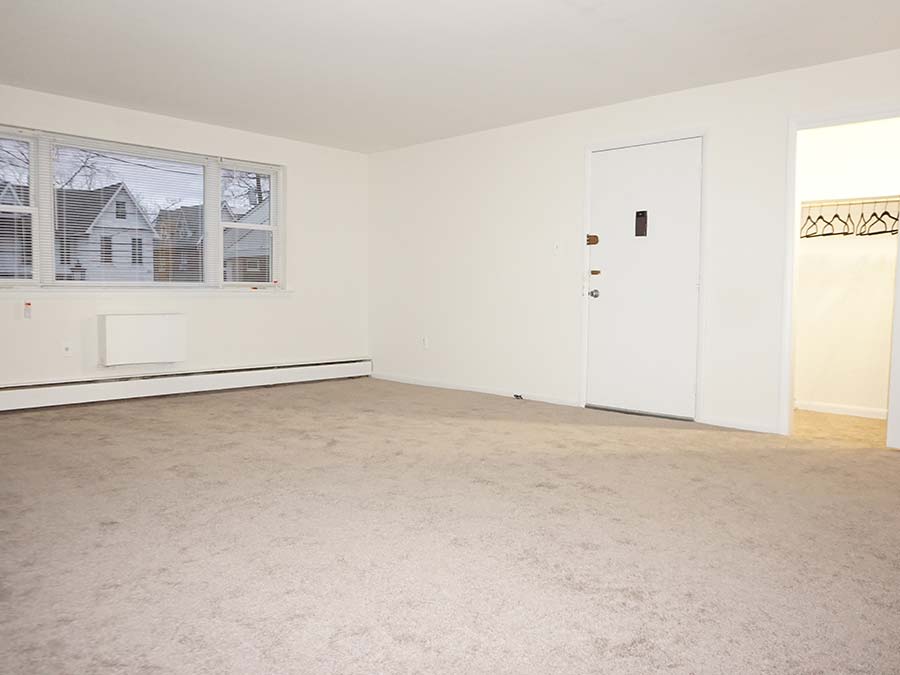 Tan carpeted bedroom with reach-in closet in Patrcia Court apartments in Lansdowne, PA.