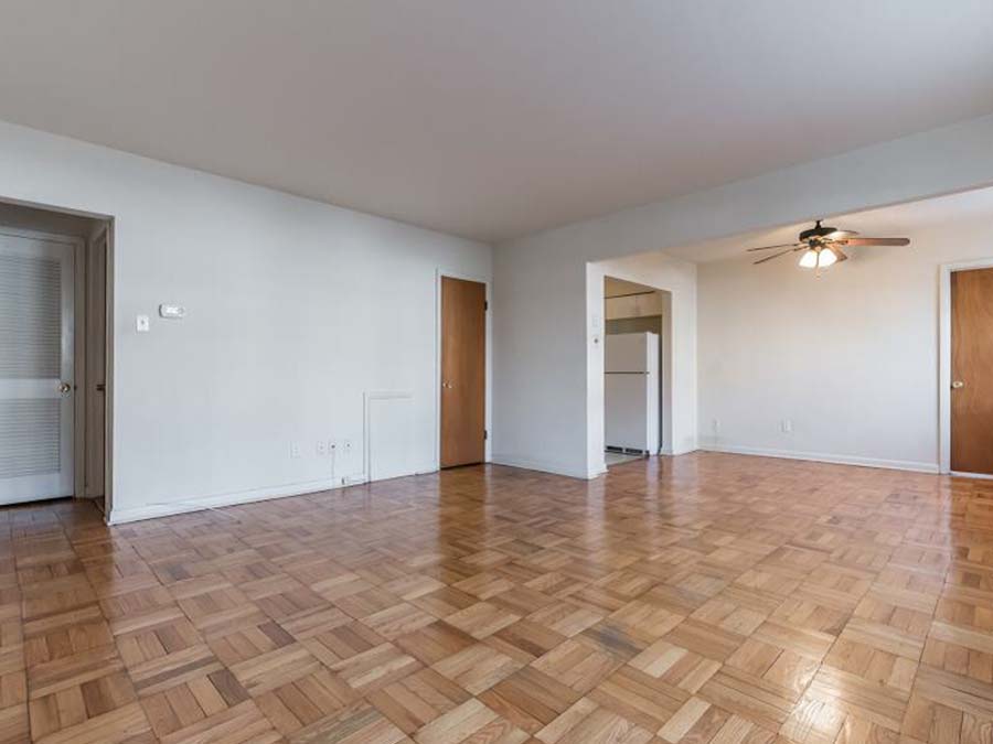 Spacious living and dining area with wood floors at the Sheldrake Apartments in Upper Darby, PA.