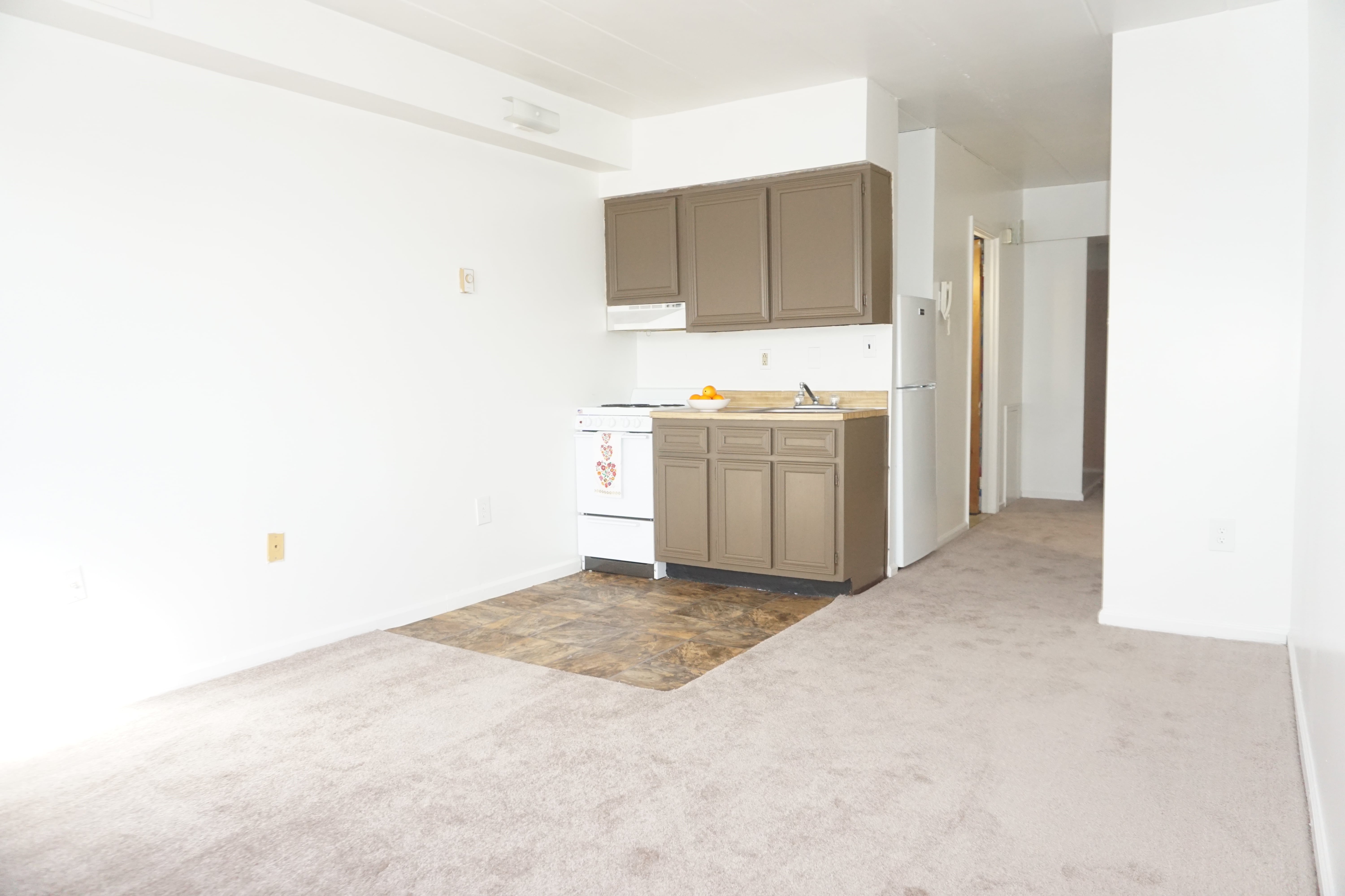 studio apartment living room and kitchen at Bridgeport Suites residential community in Bridgeport, PA