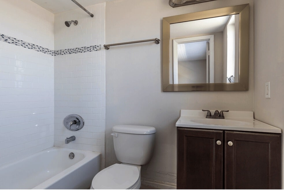 Bathroom with tub and vanity at The Villas apartments in Boynton Beach, FL.